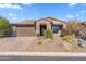 Stunning curb appeal with attractive landscaping and a two-car garage at 17674 E Fort Verde Rd, Rio Verde, AZ 85263