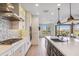 Modern kitchen with stainless steel appliances and backsplash at 17674 E Fort Verde Rd, Rio Verde, AZ 85263