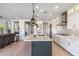 Modern kitchen with white cabinets and a large island at 17674 E Fort Verde Rd, Rio Verde, AZ 85263