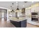 Modern kitchen featuring a large island, stainless steel appliances, and white cabinets at 17674 E Fort Verde Rd, Rio Verde, AZ 85263