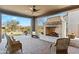 Covered patio with fireplace and seating area at 17674 E Fort Verde Rd, Rio Verde, AZ 85263