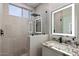 Modern bathroom with a walk-in shower and granite vanity at 1830 S Yucca St, Chandler, AZ 85286