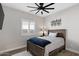 Cozy bedroom with a ceiling fan and window shutters at 1830 S Yucca St, Chandler, AZ 85286