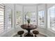 Charming breakfast nook with wood table and white shutters at 1830 S Yucca St, Chandler, AZ 85286