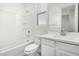 Clean bathroom with a toilet, bathtub and vanity at 19457 W Highland Ave, Litchfield Park, AZ 85340