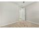 Simple bedroom with carpet, ceiling fan, and door to the bathroom at 19457 W Highland Ave, Litchfield Park, AZ 85340