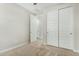 Well-lit bedroom with double door closet and carpet flooring at 19457 W Highland Ave, Litchfield Park, AZ 85340