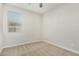 Well-lit bedroom with carpeted floors and window with blinds at 19457 W Highland Ave, Litchfield Park, AZ 85340