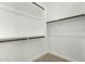 Large walk-in closet with double hanging rods and shelving at 19457 W Highland Ave, Litchfield Park, AZ 85340