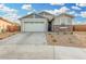 One-story home with a two-car garage and stone accents at 19457 W Highland Ave, Litchfield Park, AZ 85340