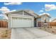 Modern one-story home with a two-car garage and stone accents at 19457 W Highland Ave, Litchfield Park, AZ 85340