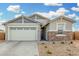 Modern one-story house with neutral colors and a two-car garage at 19457 W Highland Ave, Litchfield Park, AZ 85340