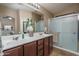 Double vanity bathroom with a large walk-in shower at 19726 W Morning Glory St, Buckeye, AZ 85326