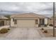 Single-story home with stone accents and a two-car garage at 19726 W Morning Glory St, Buckeye, AZ 85326