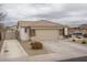 Single story home with two car garage and landscaped yard at 19726 W Morning Glory St, Buckeye, AZ 85326