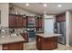 Well-equipped kitchen featuring an island and granite countertops at 19726 W Morning Glory St, Buckeye, AZ 85326