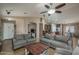 Living room with two sofas and a view into the kitchen at 19726 W Morning Glory St, Buckeye, AZ 85326