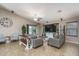 Open-concept living room featuring a farmhouse-style table at 19726 W Morning Glory St, Buckeye, AZ 85326