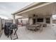 Covered patio with grill and outdoor furniture at 19726 W Morning Glory St, Buckeye, AZ 85326