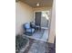 Small patio with two rocking chairs and a side table at 19851 N Greenview N Dr, Sun City West, AZ 85375