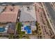 Aerial view of house, pool, and backyard. Shows surrounding neighborhood at 21622 E Via De Arboles --, Queen Creek, AZ 85142