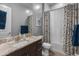 Simple bathroom with a bathtub, toilet and vanity with granite countertop at 21622 E Via De Arboles --, Queen Creek, AZ 85142