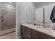 Bathroom with double vanity, granite countertop, and a large walk-in shower at 21622 E Via De Arboles --, Queen Creek, AZ 85142