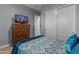 Bedroom with double bed, teal bedding, and large closet at 21622 E Via De Arboles --, Queen Creek, AZ 85142