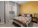 Bedroom with double bed, yellow accent wall, and gray curtains at 21622 E Via De Arboles --, Queen Creek, AZ 85142