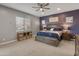 Spacious main bedroom with a king-size bed and ensuite bathroom at 21622 E Via De Arboles --, Queen Creek, AZ 85142