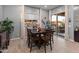 Bright dining room with patio access and wood table at 21622 E Via De Arboles --, Queen Creek, AZ 85142