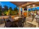 Covered patio with fire pit table and seating area next to the pool at 21622 E Via De Arboles --, Queen Creek, AZ 85142