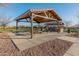 Community pavilion with picnic tables and a BBQ grill at 21622 E Via De Arboles --, Queen Creek, AZ 85142