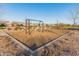 Community playground with swings and play equipment at 21622 E Via De Arboles --, Queen Creek, AZ 85142