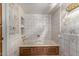 Clean bathroom with built-in shelving and bathtub at 22206 N La Senda Dr, Scottsdale, AZ 85255