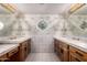 Bathroom with double vanity and decorative window at 22206 N La Senda Dr, Scottsdale, AZ 85255