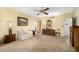 Bright bedroom featuring a comfortable sitting area and wood furniture at 22206 N La Senda Dr, Scottsdale, AZ 85255