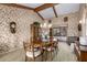 Traditional dining room with wood furnishings and floral wallpaper at 22206 N La Senda Dr, Scottsdale, AZ 85255