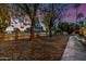 Landscaped front yard with mature trees and walkway at 22206 N La Senda Dr, Scottsdale, AZ 85255