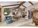 Bright and airy living room with hardwood beams and comfortable seating at 22206 N La Senda Dr, Scottsdale, AZ 85255