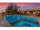 Stunning pool and spa at sunset, with a view of the house at 22206 N La Senda Dr, Scottsdale, AZ 85255