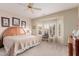 Serene bedroom with neutral tones, bay window, plantation shutters, and comfortable furnishings at 22801 N Las Vegas Dr, Sun City West, AZ 85375