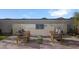 Outdoor kitchen with built-in grill and seating area at 24248 W Agora Ln, Buckeye, AZ 85326