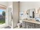 Bright bathroom featuring a standalone shower and a gray vanity with a white countertop at 2625 N 24Th St # 36, Mesa, AZ 85213