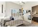 Bright bedroom featuring an accent wall of records with a full size bed at 2625 N 24Th St # 36, Mesa, AZ 85213