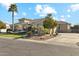 Single-story home with desert landscaping, driveway and arched entryway and windows at 2625 N 24Th St # 36, Mesa, AZ 85213