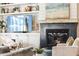 Close-up of a modern fireplace with built-in shelving and stylish décor at 2625 N 24Th St # 36, Mesa, AZ 85213