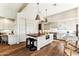 Bright kitchen with hardwood floors, a butcher block island, and modern light fixtures at 2625 N 24Th St # 36, Mesa, AZ 85213