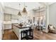 Bright kitchen with hardwood floors, a butcher block island and modern light fixtures at 2625 N 24Th St # 36, Mesa, AZ 85213