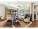 Stylish living room featuring a large window, ceiling fan, and modern fireplace with shelving at 2625 N 24Th St # 36, Mesa, AZ 85213